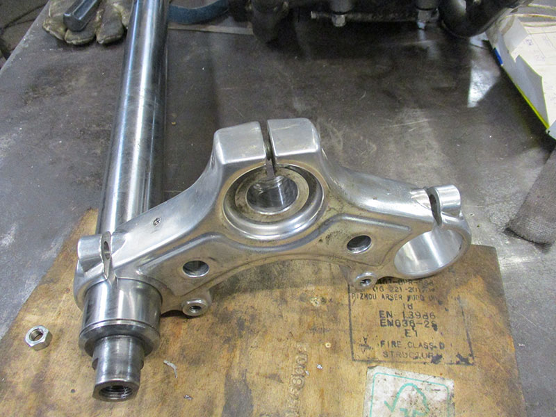 Fork fitted within top yoke