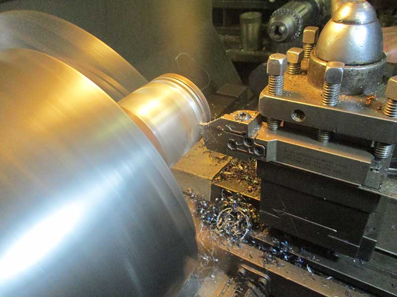 Piston being machined